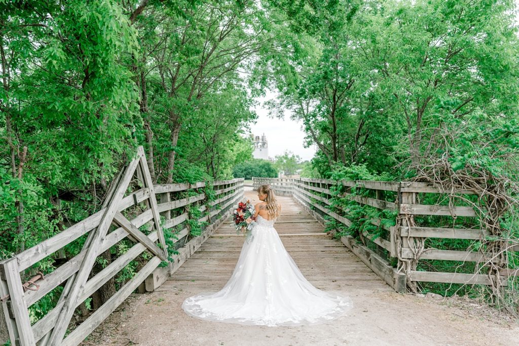 Bride standing holding bouquet in Fort Worth Stockyards bridal session