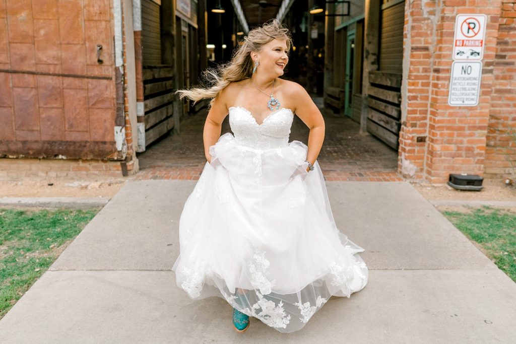 Bride running in Fort Worth Stockyards bridal session