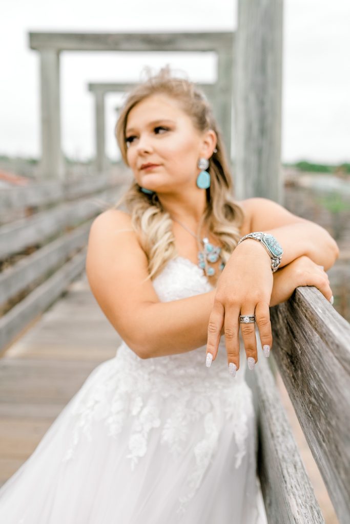 Bride showing off wedding ring in Fort Worth Stockyards Bridal session