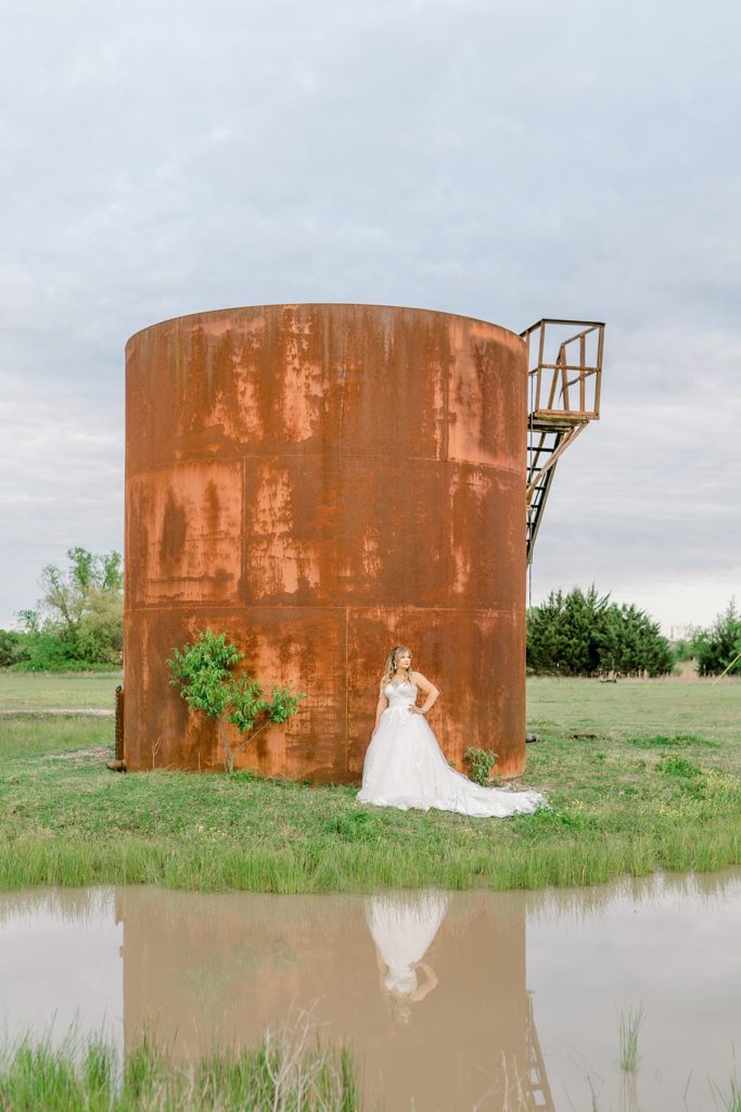 Bride standing next to tank on land
