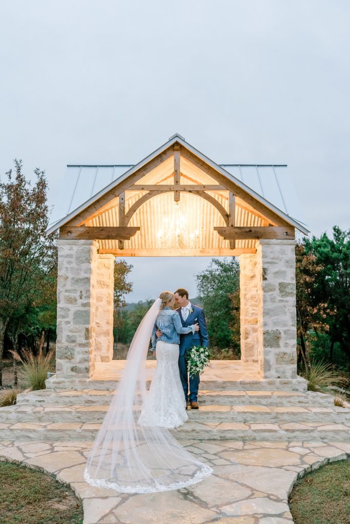 Bride and groom embracing at Five Oaks Farm wedding