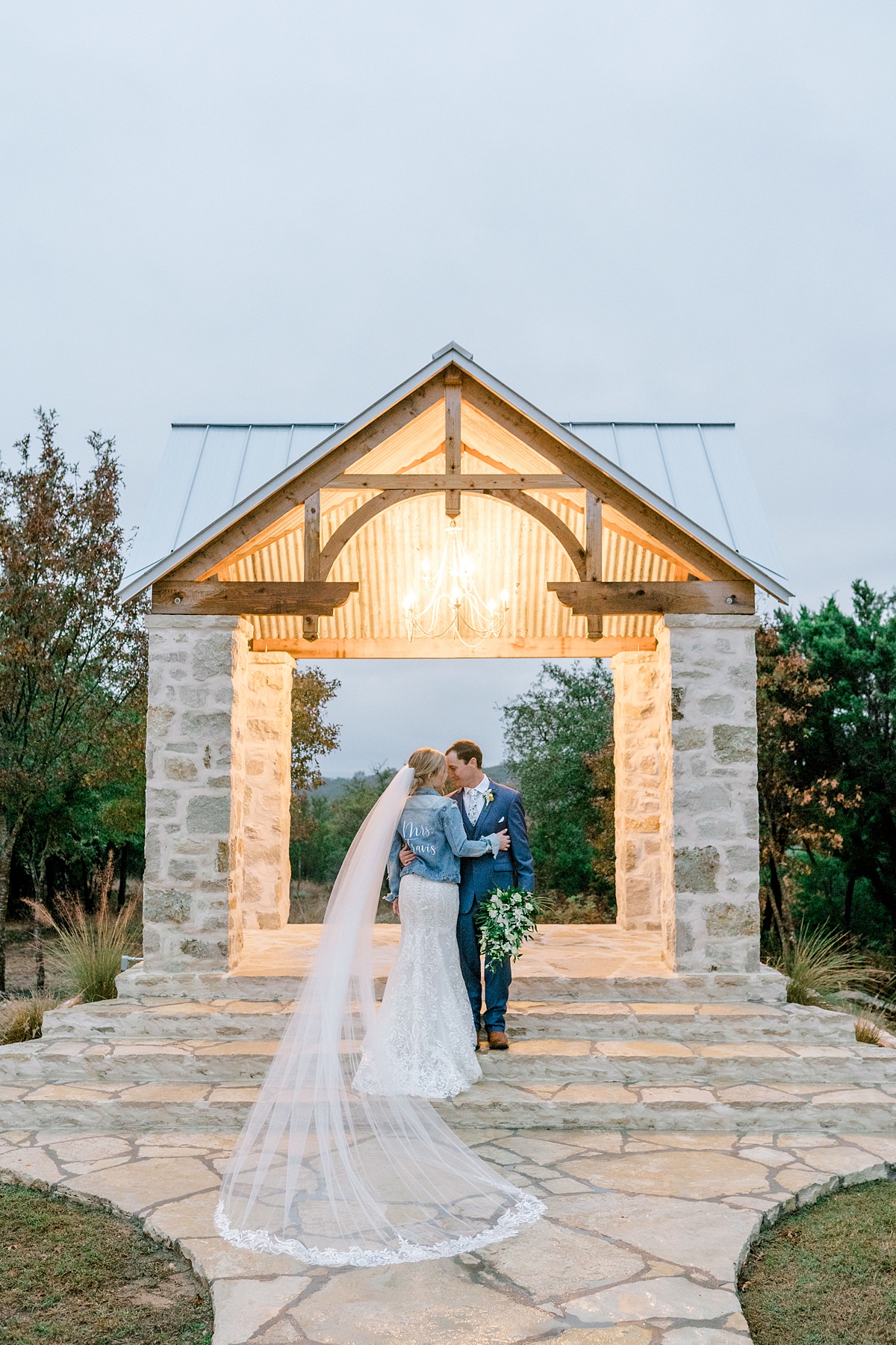 Bride and groom embracing at Five Oaks Farm wedding