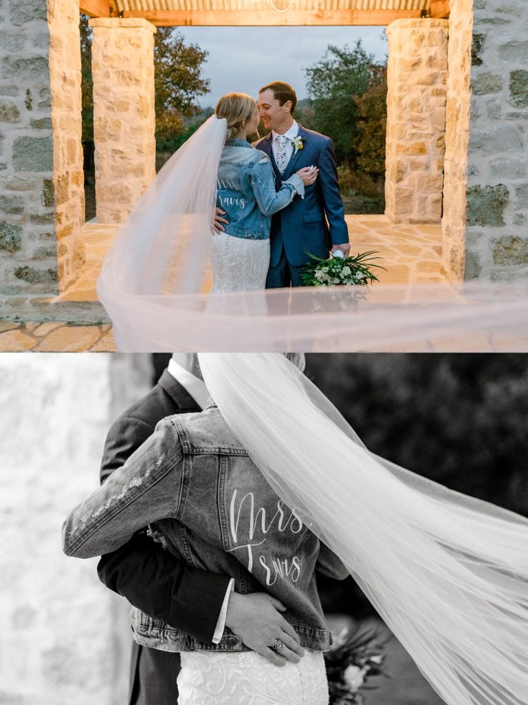 Bride and groom kissing with sweeping veil