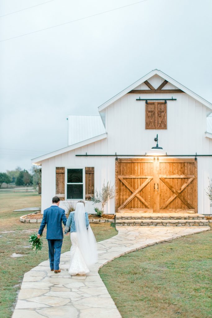 Bride and groom walking at Five Oaks Farm wedding venue