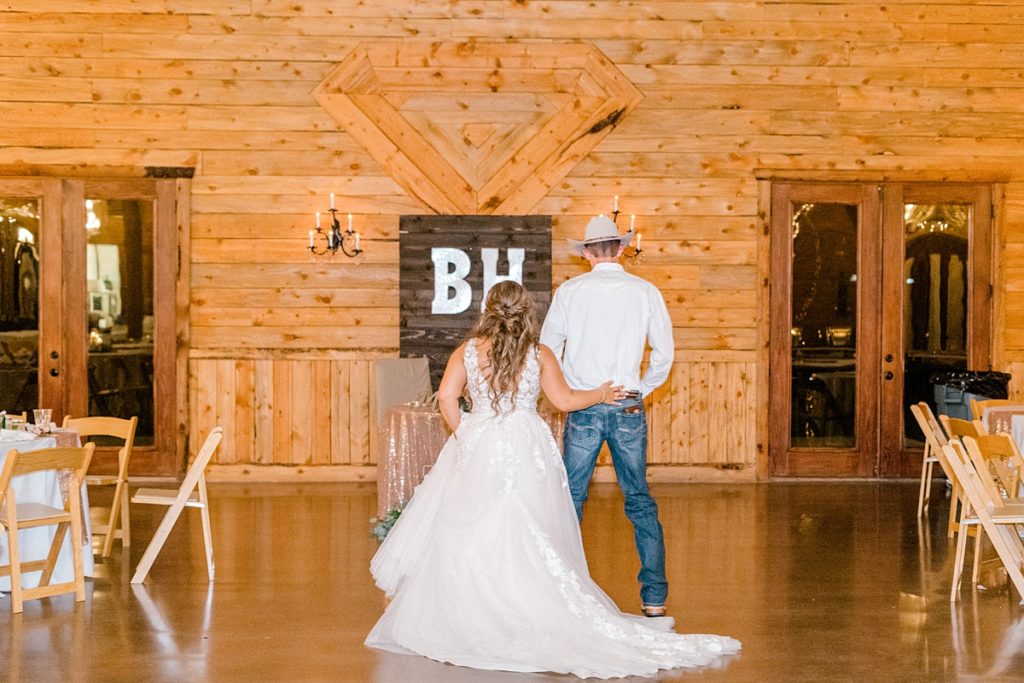 bride and groom standing at Diamond H3 Ranch wedding reception