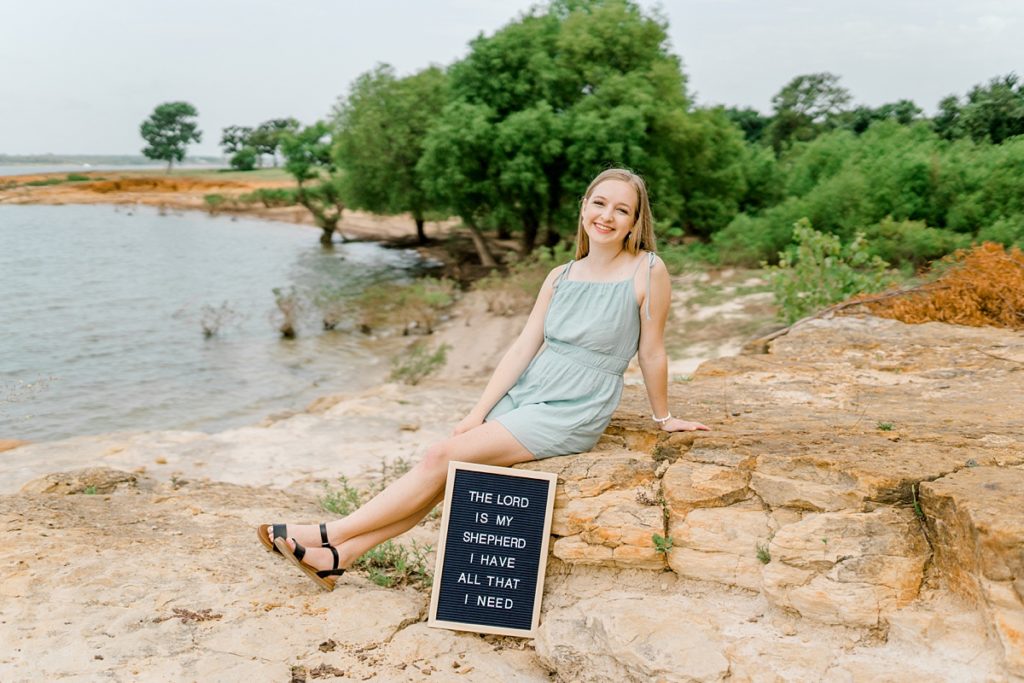 Girl posing with sign The Lord Is My Shepherd I Have All that I Need for Timber Creek senior session 
