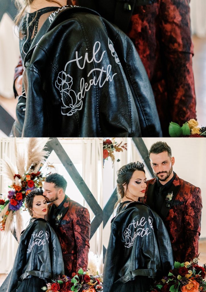 bride and groom standing together behind "til death" leather jacket