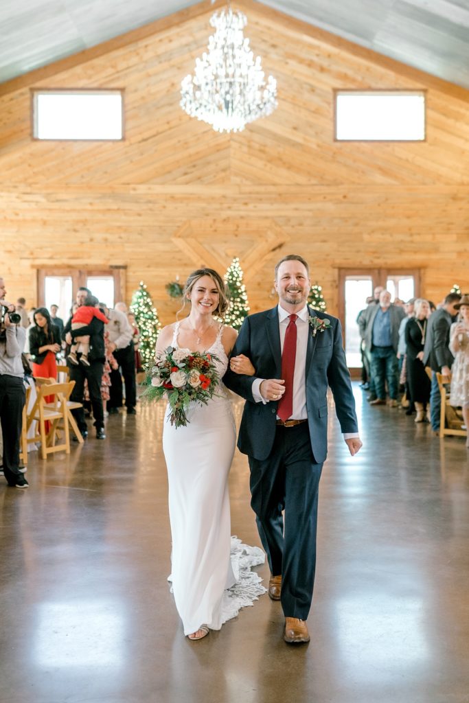 bride and groom walking down aisle together at Diamond H3 Ranch wedding