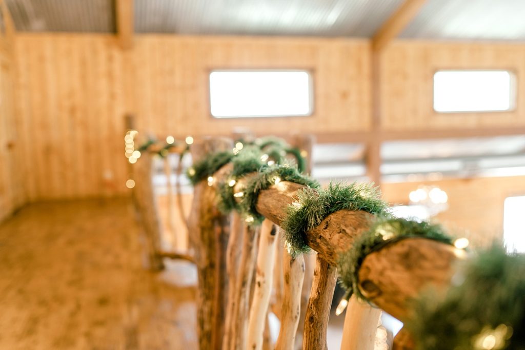 railing wrapped in tinsel for winter Christmas wedding Diamond H3 Ranch