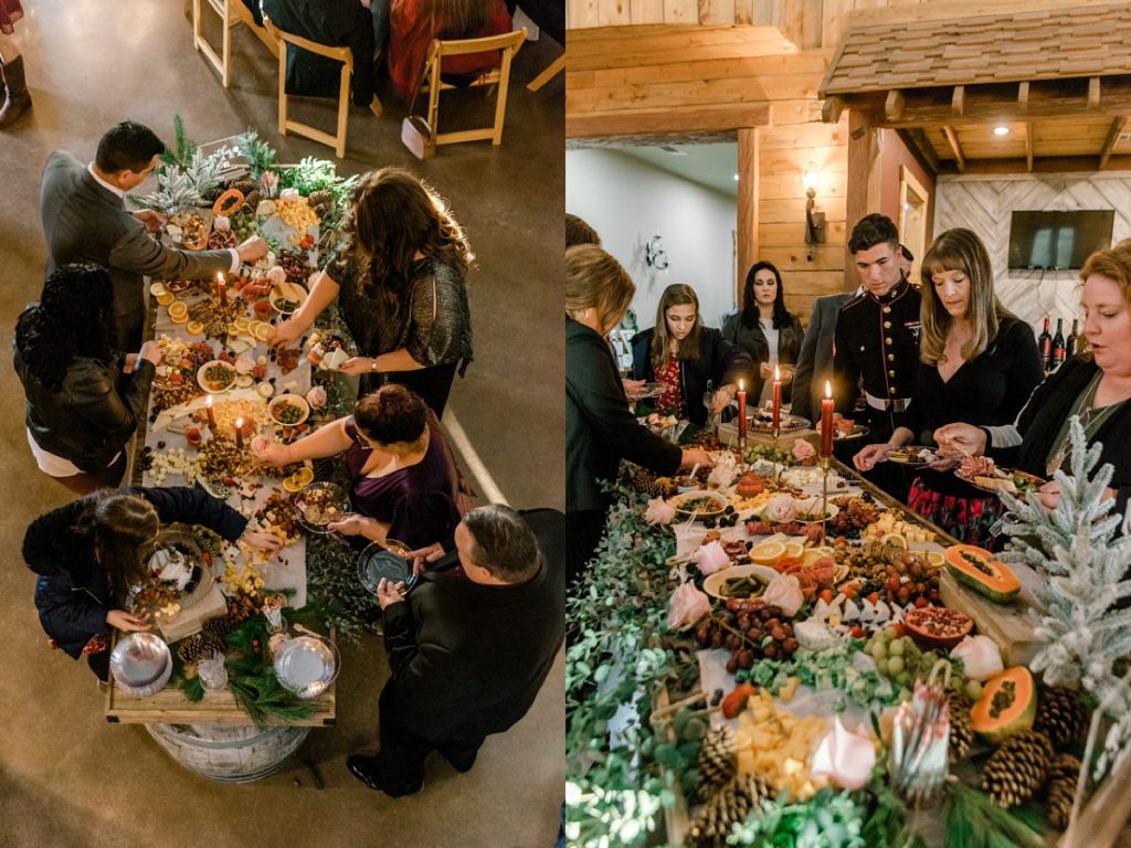 guests digging in to charcuterie at wedding reception