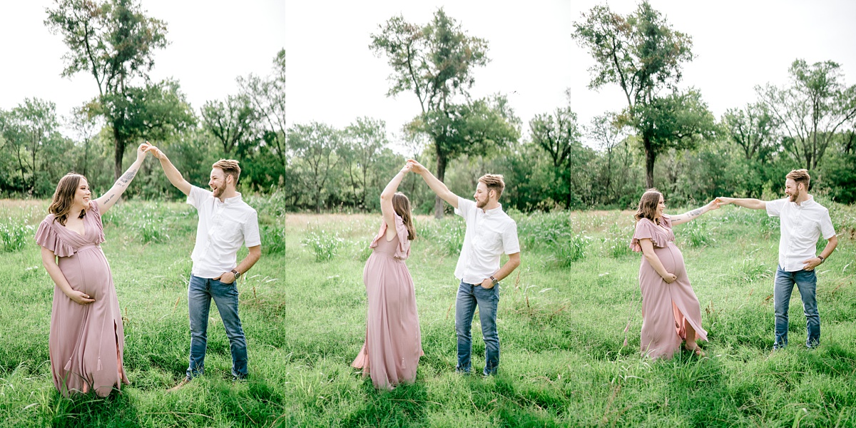 pregnant couple dancing in field for Texas maternity session