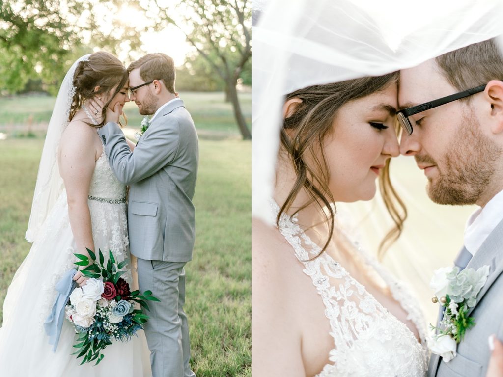 bride and groom nuzzling under wedding veil