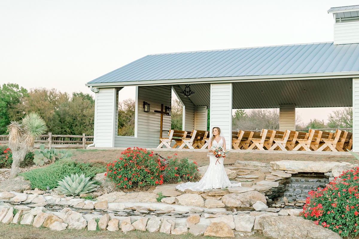 Bride standing outside open air chapel at Diamond H3 Ranch