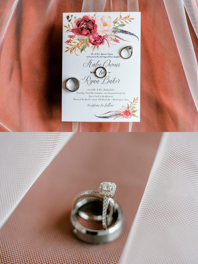 wedding rings on floral wedding invitation