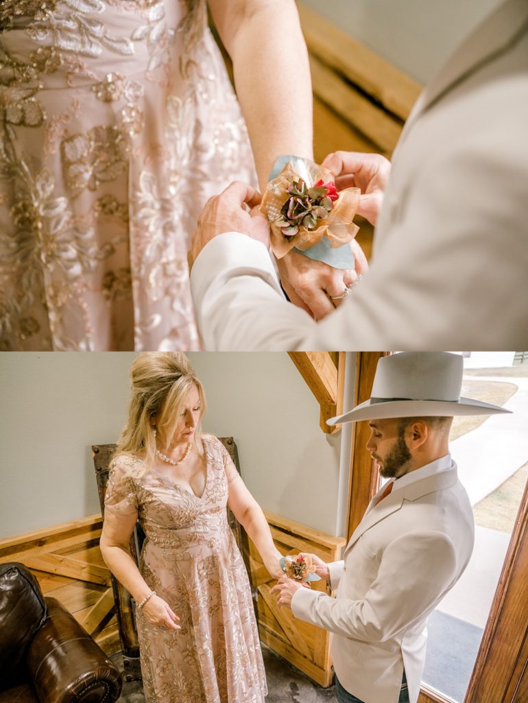 groom placing corsage on mother's wrist