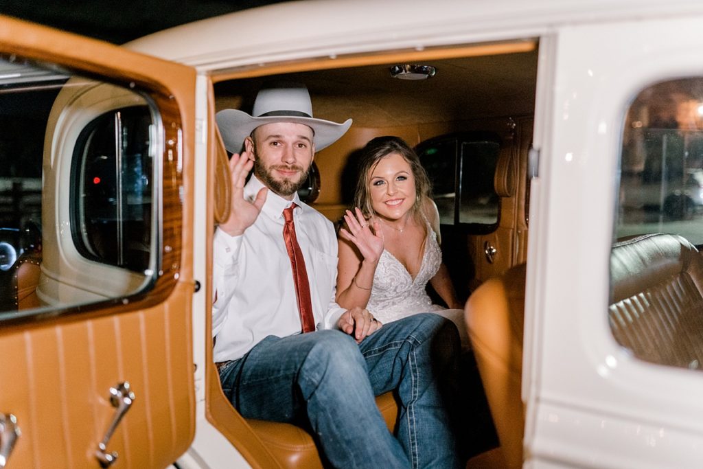 bride and groom just married getaway car